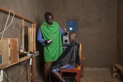 Barber giving child haircut