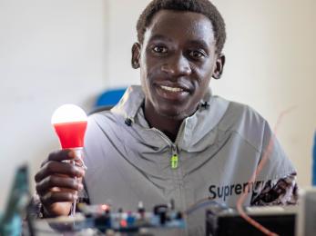 man holding lightbulb