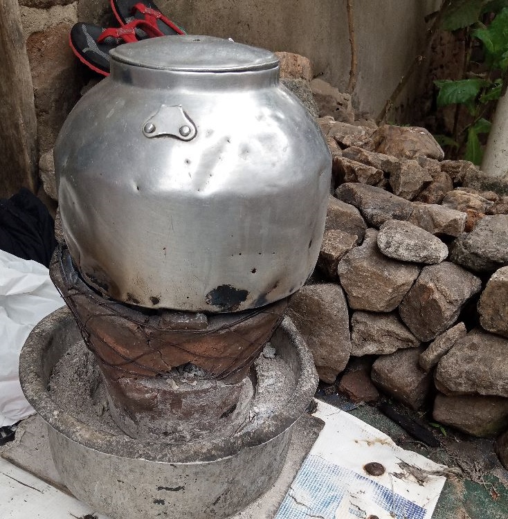 Tea brewing over a traditional cookstove